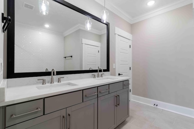 full bathroom with baseboards, visible vents, ornamental molding, and a sink