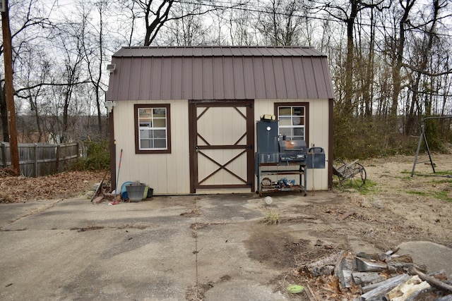 view of shed with fence