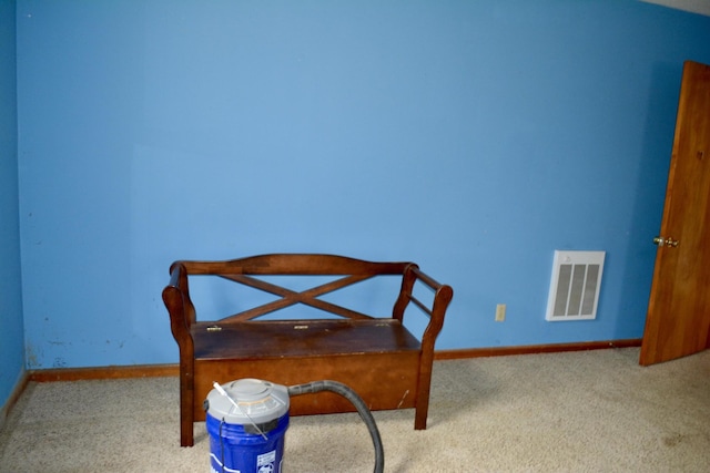 dining area with carpet floors, baseboards, and visible vents