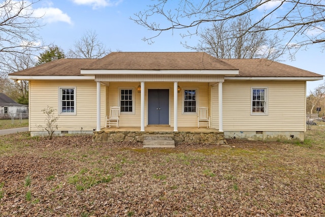 bungalow-style home featuring a porch, crawl space, and a shingled roof