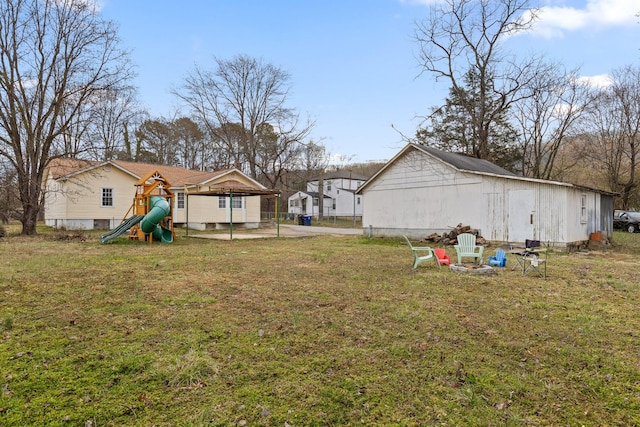 view of yard with a playground and a residential view