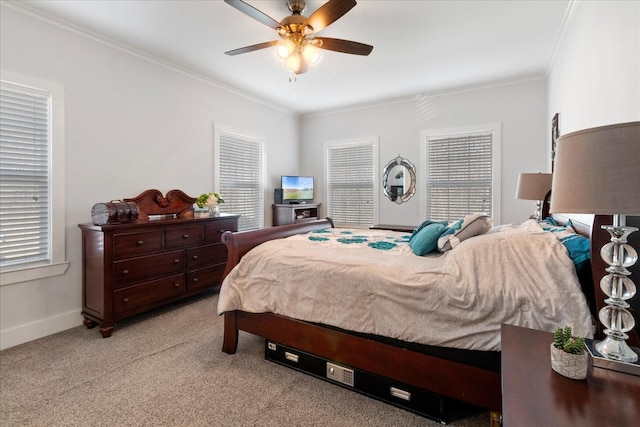 bedroom with light colored carpet, crown molding, and multiple windows