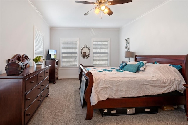 bedroom featuring light colored carpet, a ceiling fan, baseboards, and ornamental molding