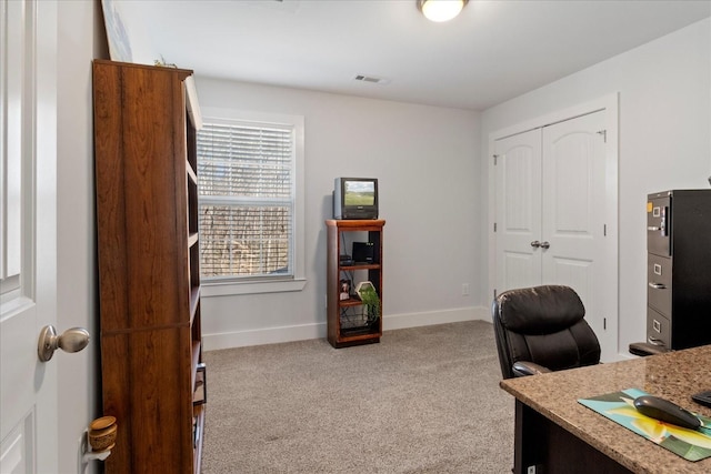 office area with visible vents, carpet floors, and baseboards