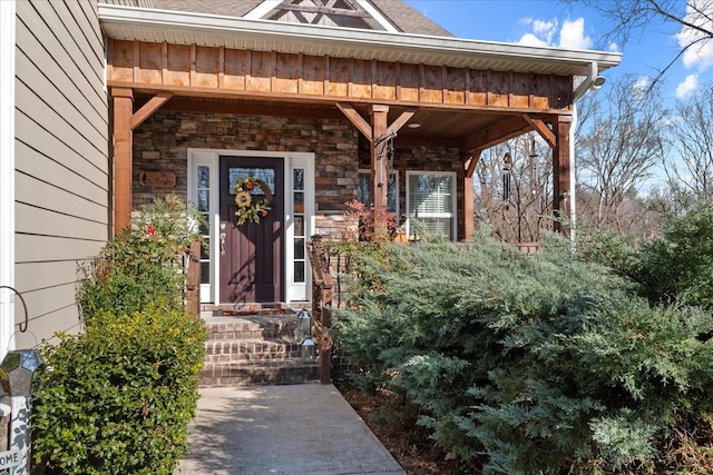 doorway to property featuring stone siding