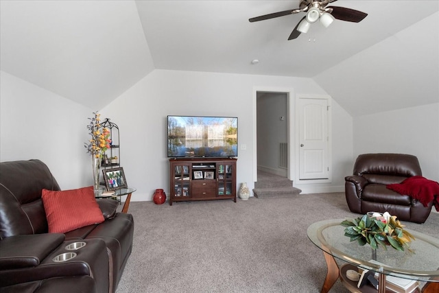 living area featuring visible vents, lofted ceiling, carpet, and a ceiling fan