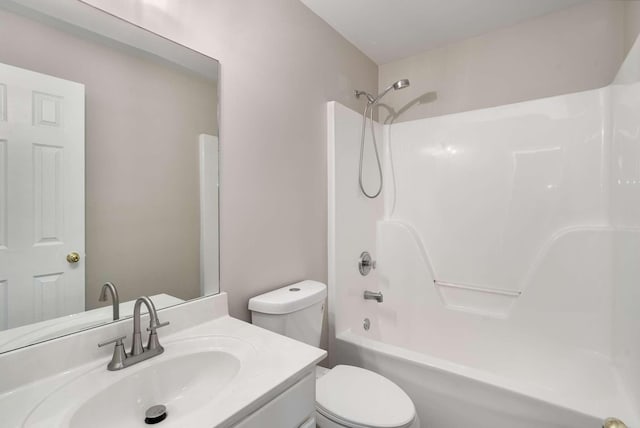 bathroom featuring shower / bath combination, vanity, and toilet