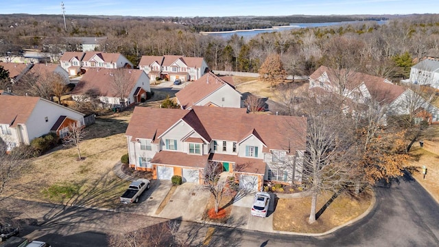 aerial view with a water view and a residential view