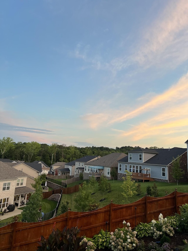 exterior space with a residential view and fence