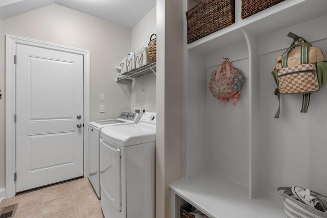 laundry area with laundry area, visible vents, independent washer and dryer, and light tile patterned flooring