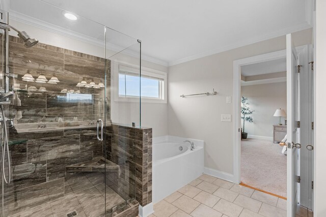 full bath with baseboards, tile patterned flooring, crown molding, a shower stall, and a bath