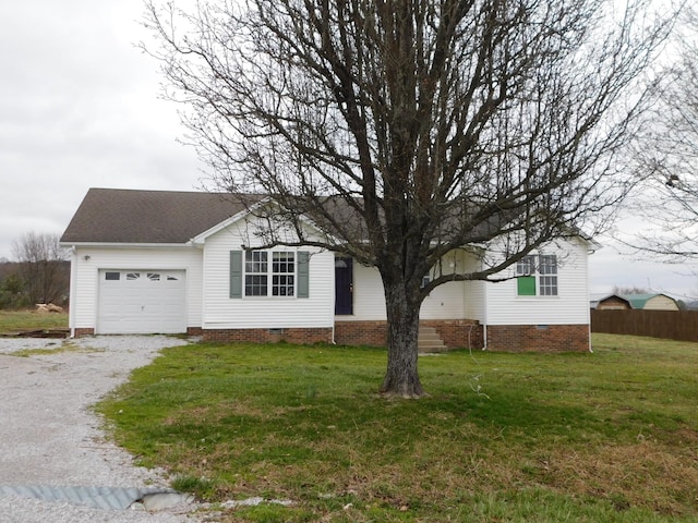 ranch-style house featuring crawl space, fence, a garage, driveway, and a front lawn