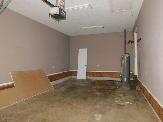 garage featuring gas water heater and a garage door opener