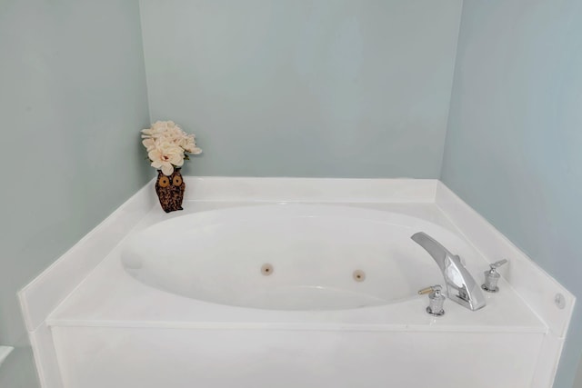 bathroom featuring a tub with jets