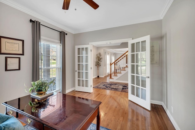 office with crown molding, french doors, wood finished floors, and baseboards