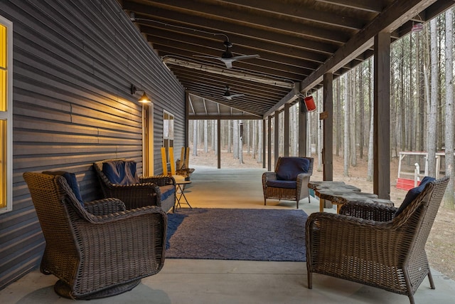 sunroom / solarium featuring ceiling fan