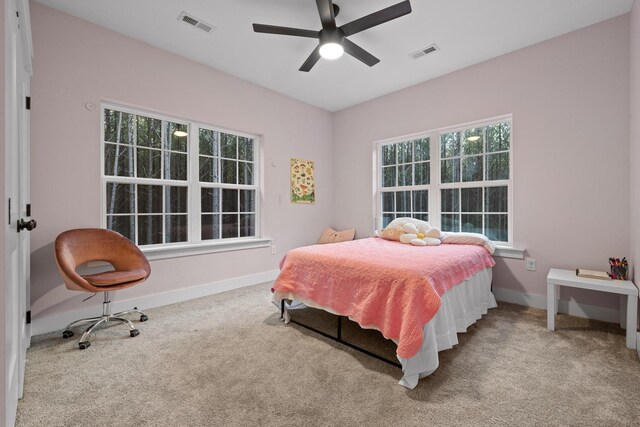 bedroom featuring carpet floors, visible vents, and baseboards