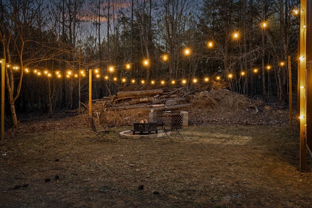 view of yard featuring a fire pit