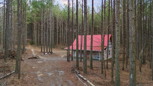 exterior space featuring a view of trees