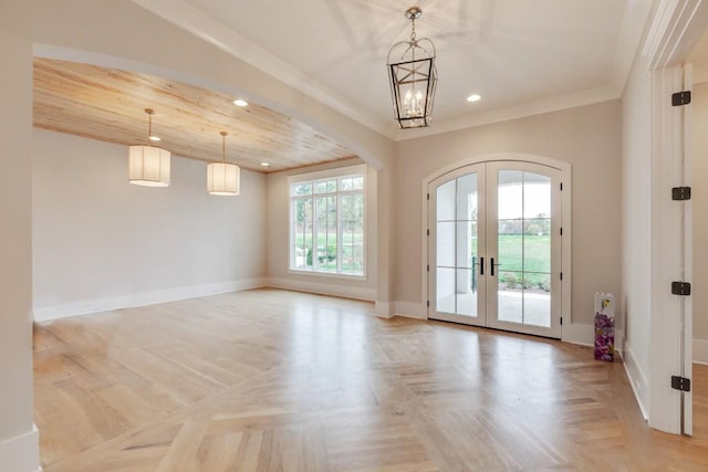 interior space featuring crown molding, baseboards, recessed lighting, french doors, and arched walkways