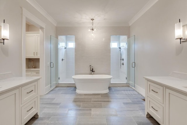 bathroom with a shower stall, a soaking tub, a healthy amount of sunlight, and crown molding