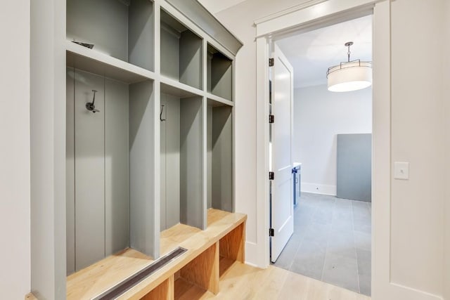 mudroom with light wood-style flooring