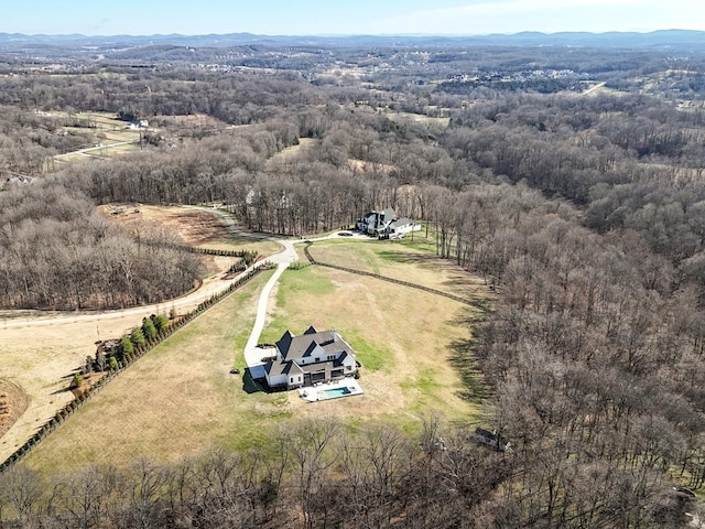 drone / aerial view with a rural view and a forest view