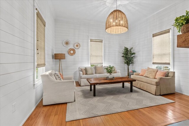 living room with hardwood / wood-style flooring and baseboards