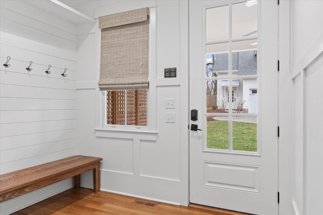 mudroom featuring visible vents and wood finished floors