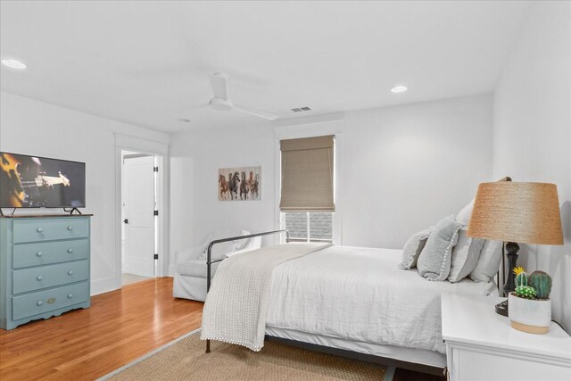 bedroom featuring recessed lighting, ceiling fan, and wood finished floors