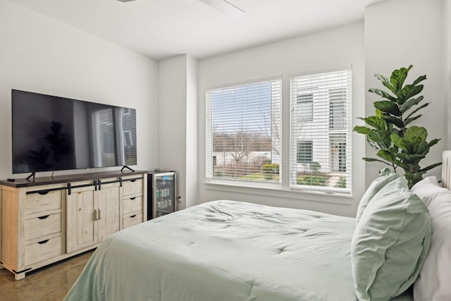 bedroom featuring ceiling fan and wine cooler