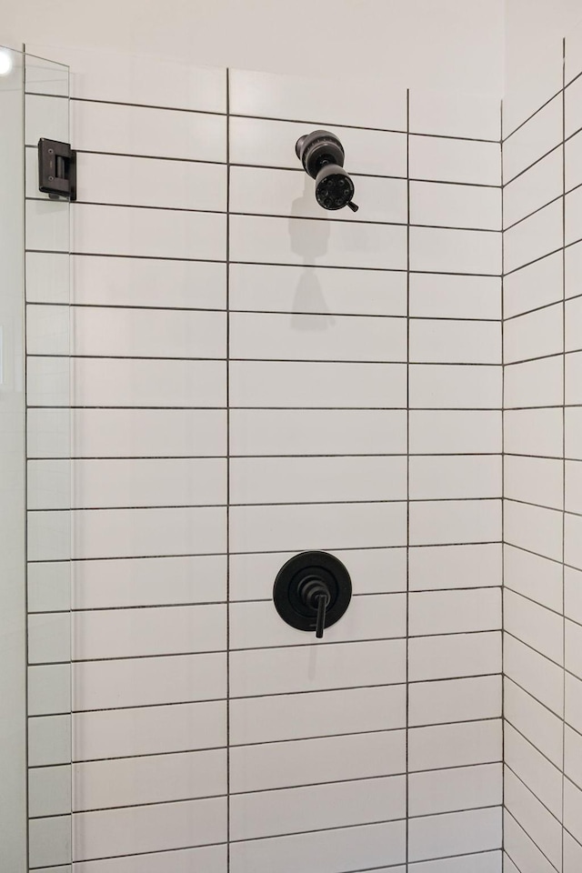 details with a tile shower