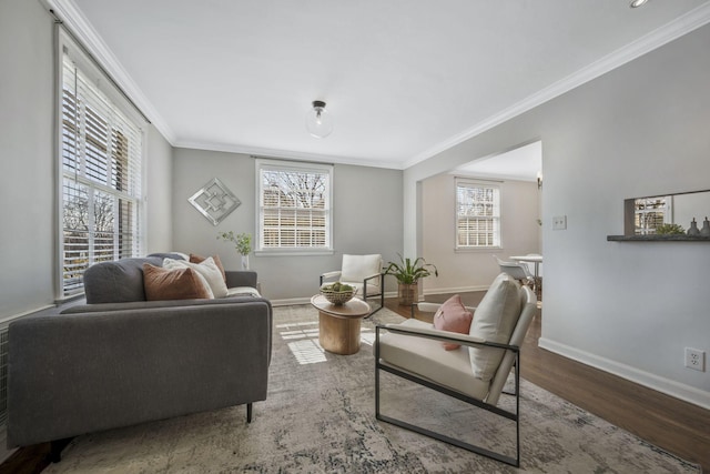 living room featuring crown molding, wood finished floors, and baseboards