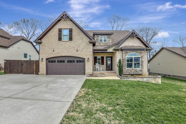 view of front of property featuring driveway, a garage, fence, a front lawn, and brick siding