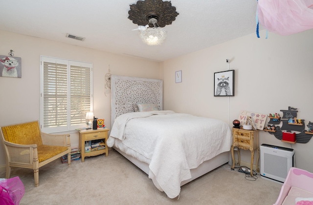 bedroom featuring carpet and visible vents