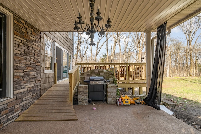 view of patio / terrace with area for grilling and a wooden deck