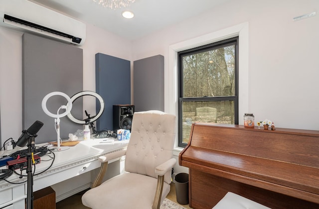 office area with an AC wall unit, a barn door, and a wealth of natural light