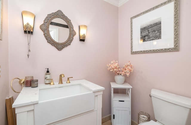 half bath with vanity and toilet