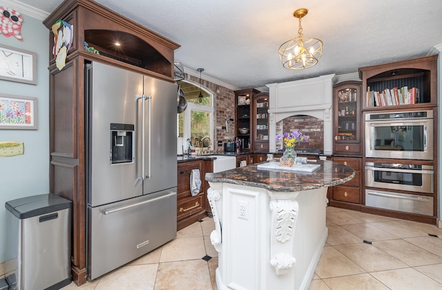 kitchen with a warming drawer, light tile patterned floors, appliances with stainless steel finishes, glass insert cabinets, and a kitchen island