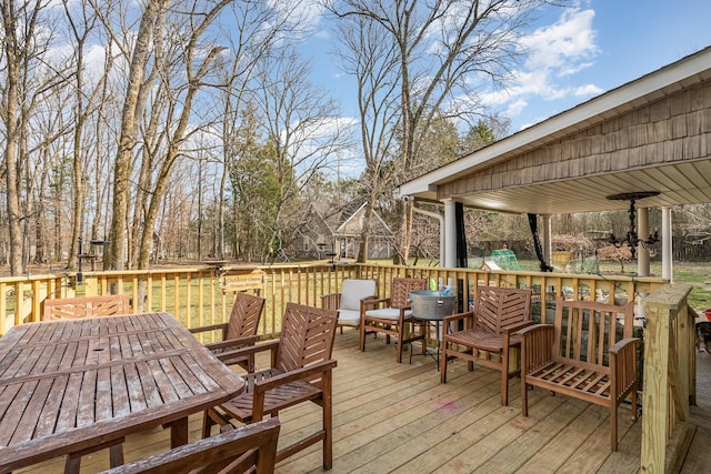 wooden deck featuring outdoor dining space