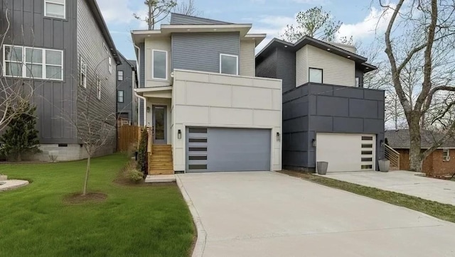 contemporary home featuring a garage, a balcony, a front lawn, and concrete driveway