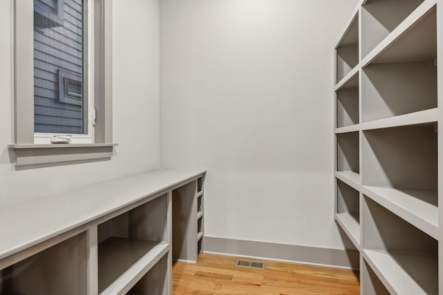 spacious closet featuring light wood finished floors and visible vents