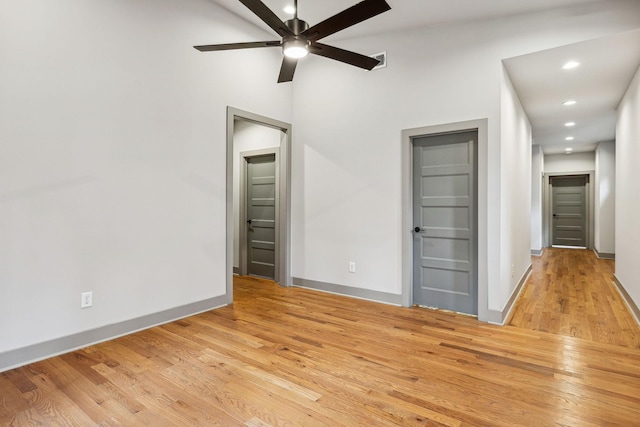 unfurnished room featuring recessed lighting, baseboards, visible vents, and light wood finished floors