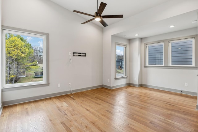 unfurnished room featuring light wood-style floors, baseboards, a ceiling fan, and recessed lighting