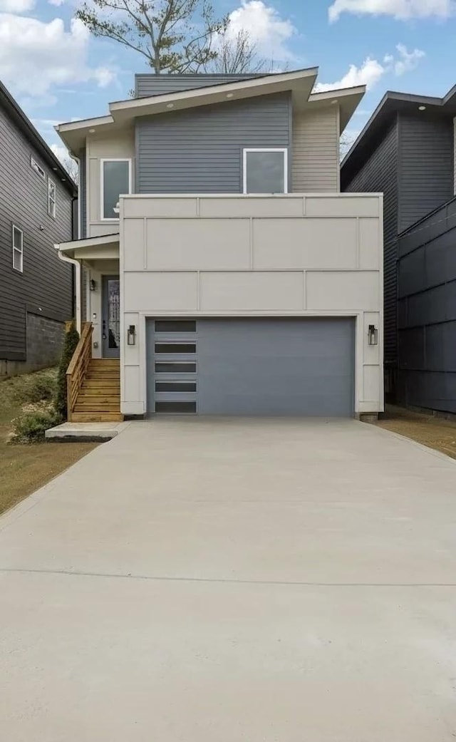 contemporary home with a garage and driveway