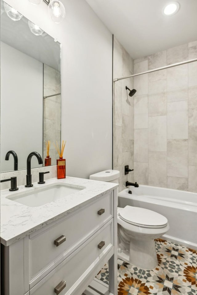 full bath featuring toilet, shower / washtub combination, and vanity