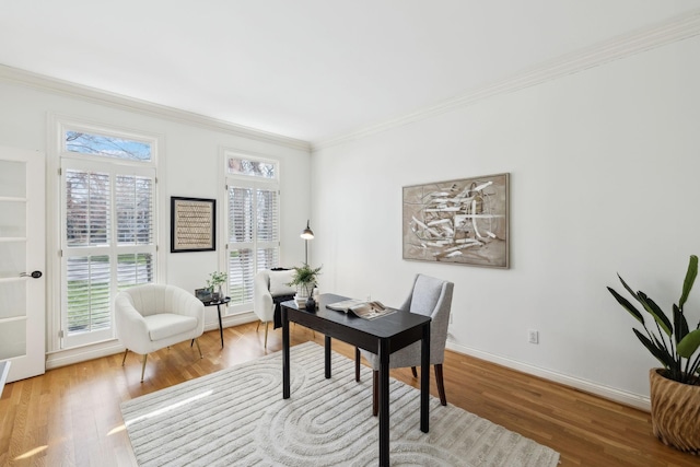 home office with baseboards, wood finished floors, and crown molding