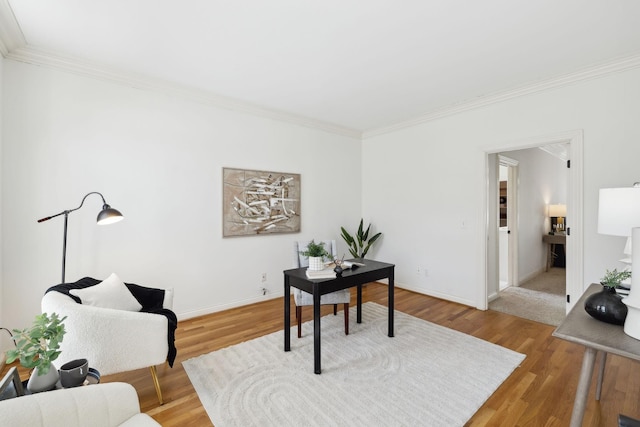 home office with baseboards, wood finished floors, and ornamental molding