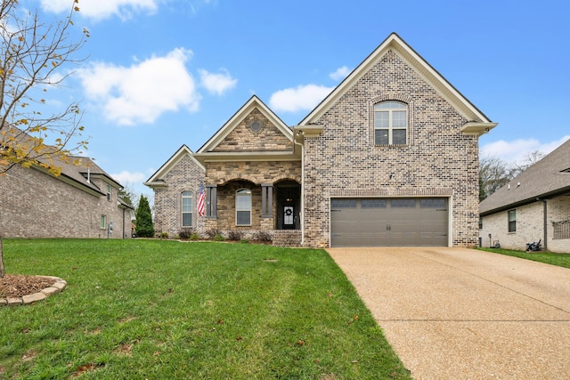 view of front of property featuring driveway, brick siding, a front lawn, and an attached garage