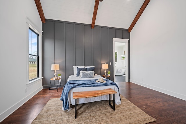 bedroom featuring multiple windows, baseboards, and wood finished floors